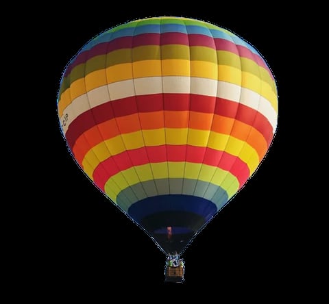 Colorful hot air balloon with red, yellow, orange, and blue stripes floating against a black background